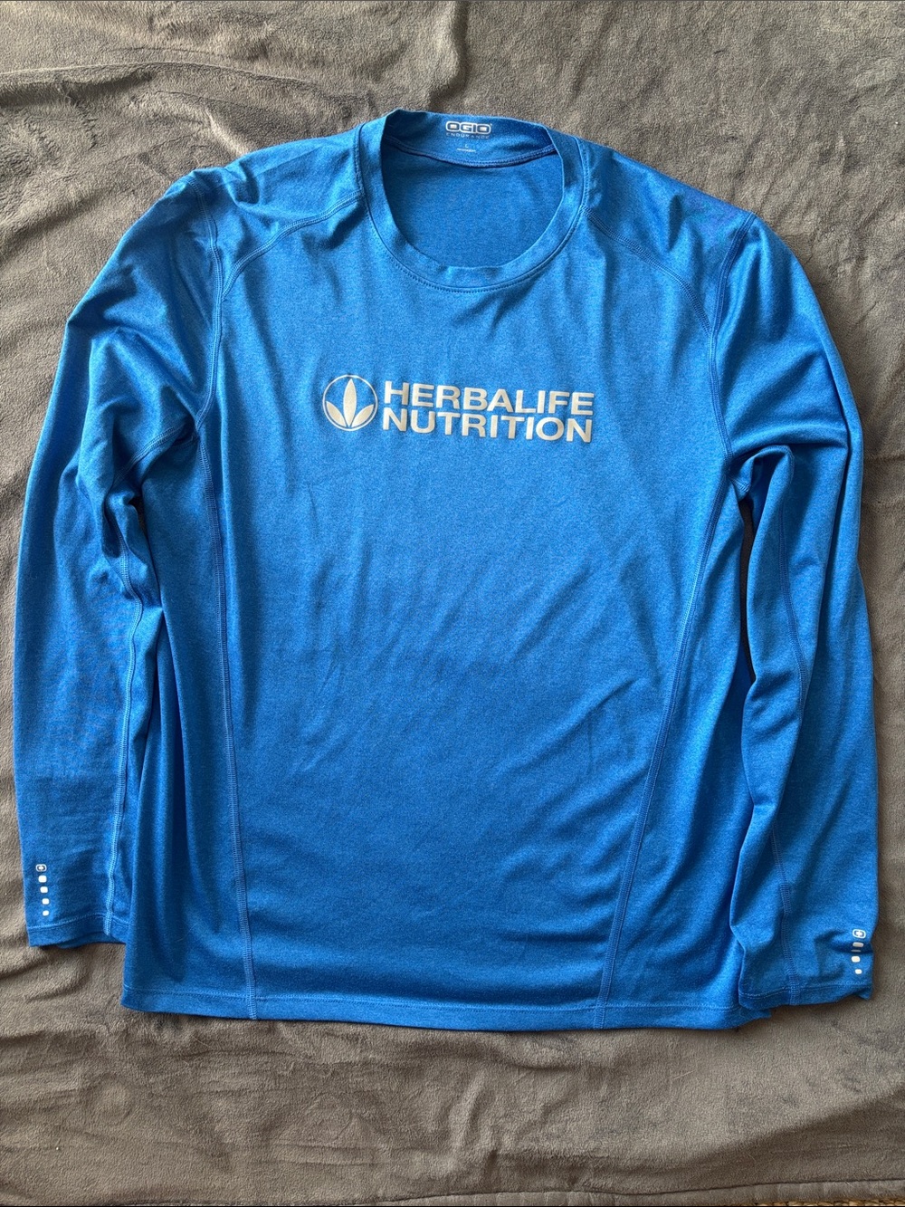 OGIO Men's Long Sleeve Performance Shirt - Blue with White Herbal life Logo